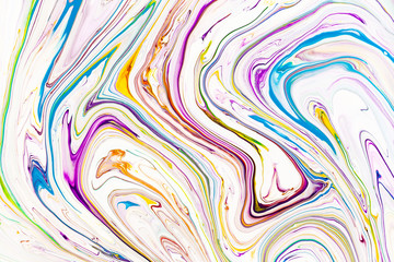 Oil paint mix abstract background. Rainbow marble texture. Acrylic liquid flow colorful wallpaper. Creative violet, yellow, blue paint swirls, waves. Multicolor watercolor pattern, fluid effect.