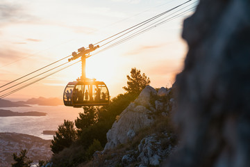 The cable way of Dubrovnik in backlight at sunset