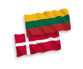 National vector fabric wave flags of Lithuania and Denmark isolated on white background. 1 to 2 proportion.