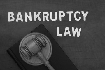 Bankruptcy law concept. Judge gavel and words bankruptcy law on wooden table