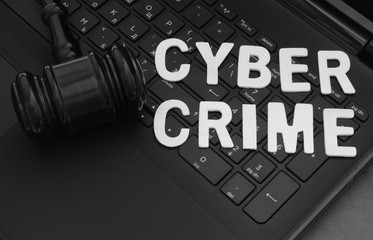 Cyber law and crimeconcept, judge gavel on computer keyboard
