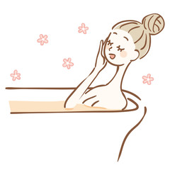 入浴剤を入れたお風呂に入る女性