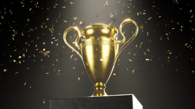 Golden metallic trophy cup on the platform. Award for a winner. Celebration.