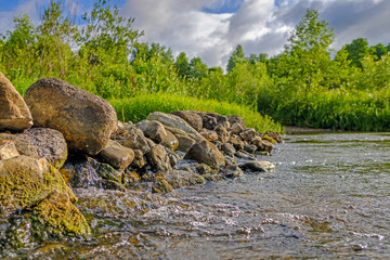 Boulders on the forest river.