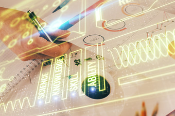 Man's hands working with notes background. Modern computer record diagram with virtual mnitor.