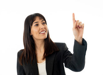 Portrait of a young beautiful and confident business woman pointing. Isolated on white background.