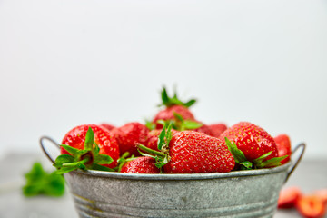 Ripe red strawberries on black table, Strawberries in white bowl. Fresh strawberries. grey strawberries. Diet food. Healthy, vegan. Close up. Copy space.