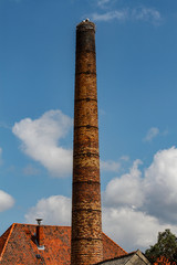 Chimney with storks in an old factory