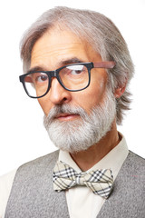 Senior man with a gray beard and glasses isolated on white background