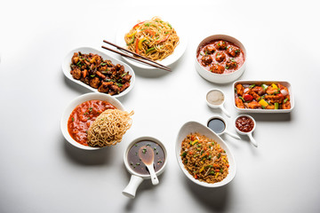 Assorted Indo chinese dishes in group includes Schezwan/Szechuan hakka noodles, veg fried rice, veg manchurian, american chop suey, chilli paneer, crispy vegetable and vegetable soup