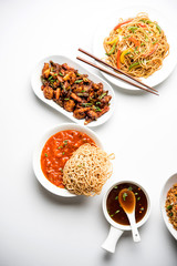 Assorted Indo chinese dishes in group includes Schezwan/Szechuan hakka noodles, veg fried rice, veg manchurian, american chop suey, chilli paneer, crispy vegetable and vegetable soup