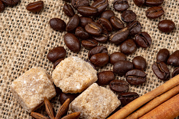 Coffee Beans Arabica Canvas Background. Close-up photo. background with the addition of anise and cinnamon.