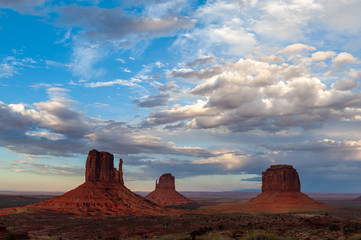 The famous Merrick and Mittens Buttes from monument valley basking in the Light of the setting sun.