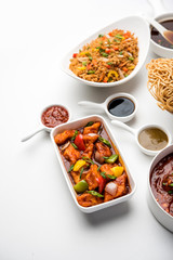 Assorted Indo chinese dishes in group includes Schezwan/Szechuan hakka noodles, veg fried rice, veg manchurian, american chop suey, chilli paneer, crispy vegetable and vegetable soup