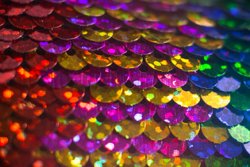 Shiny colorful sequin dress detail texture. Neon disco color