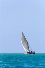 transport dhow seen from a distance showing open ocean and flat horizon