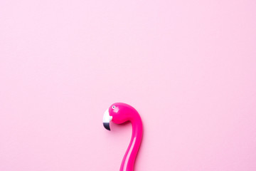 Pink pen Flamingo on a pink background. Copy space Flat lay.