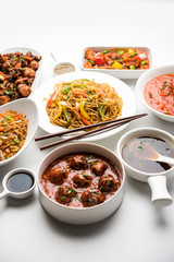 Assorted Indo chinese dishes in group includes Schezwan/Szechuan hakka noodles, veg fried rice, veg manchurian, american chop suey, chilli paneer, crispy vegetable and vegetable soup