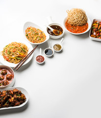 Assorted Indo chinese dishes in group includes Schezwan/Szechuan hakka noodles, veg fried rice, veg manchurian, american chop suey, chilli paneer, crispy vegetable and vegetable soup