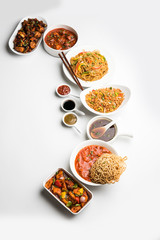 Assorted Indo chinese dishes in group includes Schezwan/Szechuan hakka noodles, veg fried rice, veg manchurian, american chop suey, chilli paneer, crispy vegetable and vegetable soup
