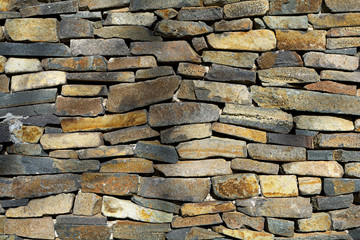 Colourful old stone wall texture, architectural background