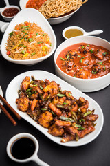 Assorted Indo chinese dishes in group includes Schezwan/Szechuan hakka noodles, veg fried rice, veg manchurian, american chop suey, chilli paneer, crispy vegetable and vegetable soup