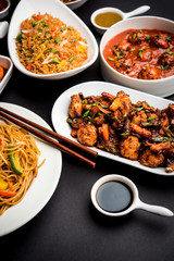 Assorted Indo chinese dishes in group includes Schezwan/Szechuan hakka noodles, veg fried rice, veg manchurian, american chop suey, chilli paneer, crispy vegetable and vegetable soup