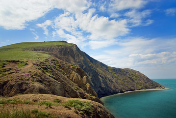 Fototapeta na wymiar Beautiful sea view with big green rock