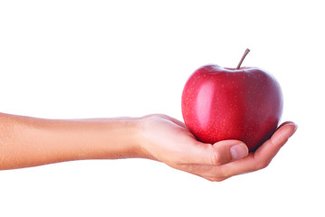 Close up studio shot of female hand holding fresh apple. Isolated on white background.