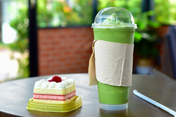  Cupcakes and green tea spun on the table