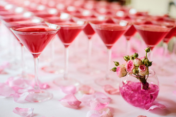 Table setting for party. Wineglasses with pink martini.