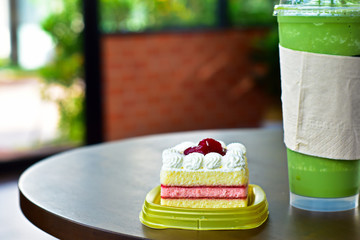  Cupcakes and green tea spun on the table