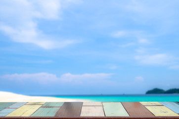 the wood table on blurred sea with  background - Empty ready for your product display montage. Concept of beach in summer. vintage color tone.