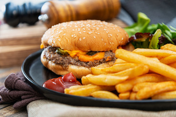Cheese burger - American cheese burger with Golden French fries