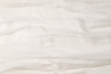 Soft smooth white silk fabric background. Fabric texture.