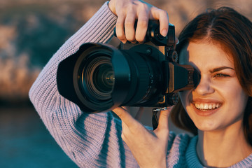 woman taking photo with digital camera