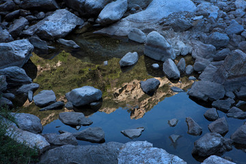 Reflection of mountains in water. Rocks. Languedoc France