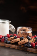Breakfast ready to be served made out of tasty chocolate chips, milk and fresh bluebarries
