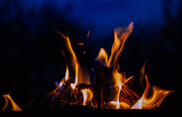 Fire flames and hot charcoal at night