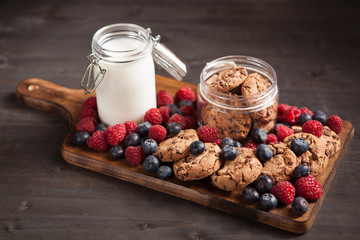 Fresh milk next to delicious chocolate chips with dark chocolate