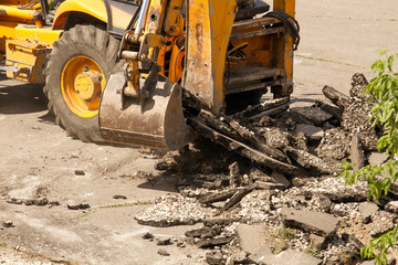 Fototapeta premium Tractor Dismantles Asphalt