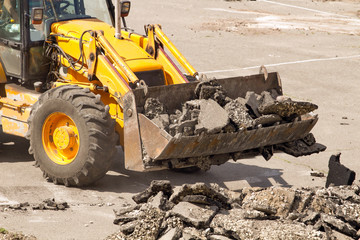 Tractor Dismantles Asphalt