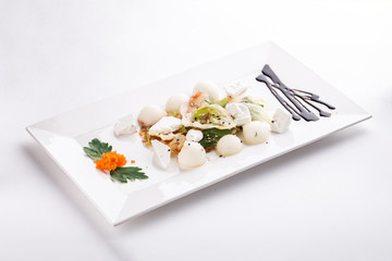 Fresh salad with mixed greens, sesame and cheese isolated on white background