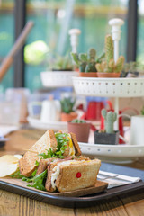 Selective focus of club sandwich with bacon - chicken, fie egg, cheese, potato and lettuce on...