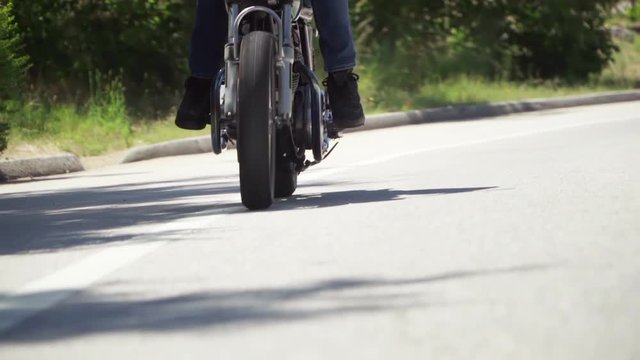 Slow Motion Close Up of Motorcycle Wheel While Riding
