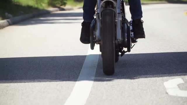 Slow Motion Close Up of Motorcycle Wheel While Riding