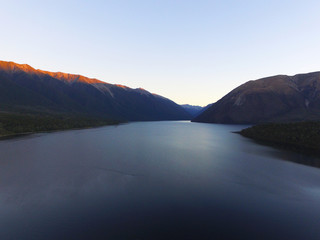Lake at sunset drone shot