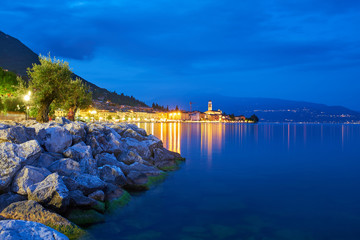 Night view of the city center of Salo on the shores of Lake Garda Italy. Photo taken at long exposure.