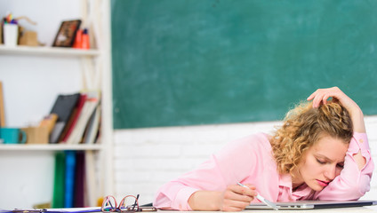 Tired tutor fall asleep at workplace. Tired student lean on desk. Exhausting lesson. Teacher...