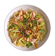 Udon with Chicken and Peanut Garlic Sauce with sesame in a white bowl isolated on white background.